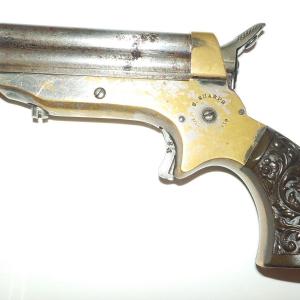 Photo of 1860 Sharps 4 shot derriger 22 cal. rim fired pistol.