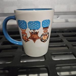 Photo of Coffee mug with badges