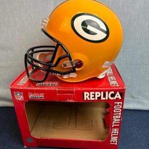 Photo of Lot 135 Full-size Green Bay Packers replica football helmet by Riddell sports