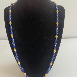Photo of Lapis and faux gold bead necklace. 24”