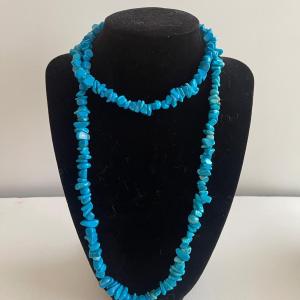 Photo of Turquoise shell 16” necklace.