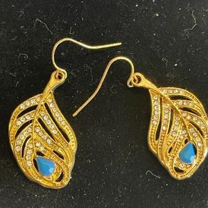 Photo of Gold tone leaf earrings with rhinestones and blue stone.
