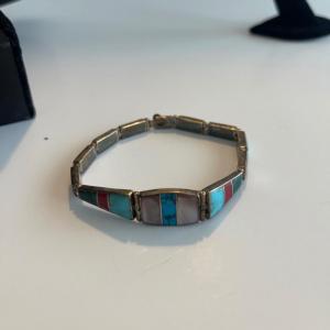 Photo of Sterling silver bracelet with turquoise and mother of pearl inlays.