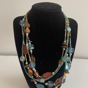 Photo of 20” multi-strand necklace. Stones. Wood, faux pearls and glass beads. Adjustab