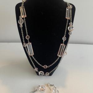 Photo of Double strand adjustable 34” pink crystal necklace and matching earrings.