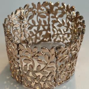 Photo of 1 1/2” thick stretch bracelet. Branches design.