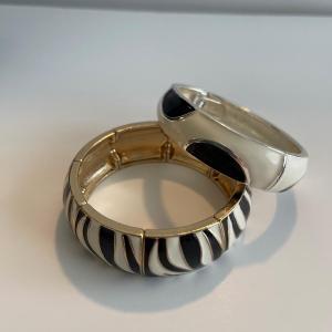 Photo of Two animal print bracelets. One is a stretch bracelet and one is a hinges bracel