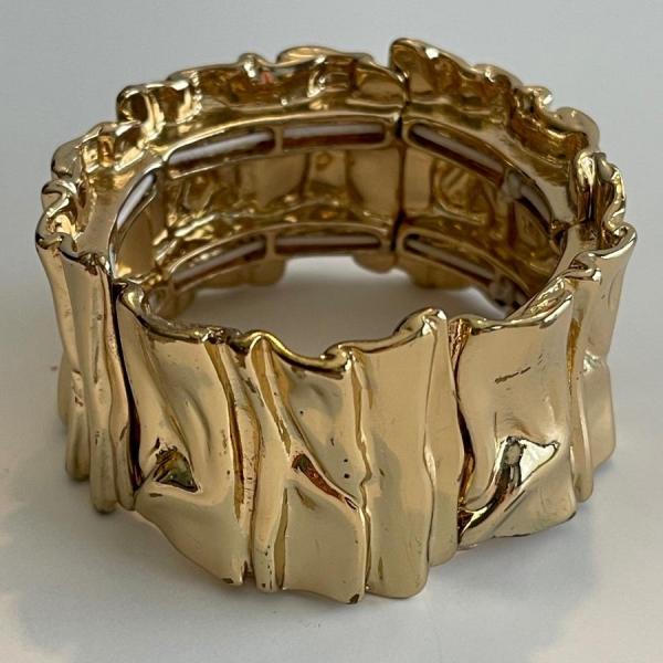 Photo of Bracelet 6” stretch. 1 1/2 thick gold tone. Vtg