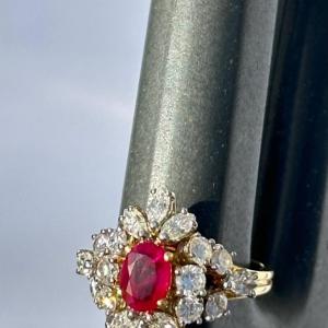 Photo of 18 kt gold ring with a 1 carat ruby and 1.8 ct total weight of diamonds.
