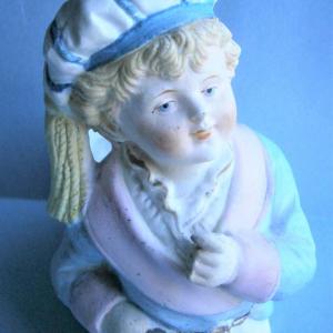 Photo of Figurine of Victorian Boy with Purse Match Holder