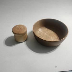 Photo of Timeless wooden bowl and small container with lid