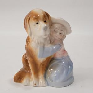 Photo of Small figurine girl and dog.