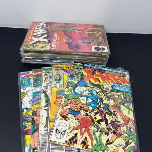 Photo of 24 Vintage XMen Comics in Plastic Protectors