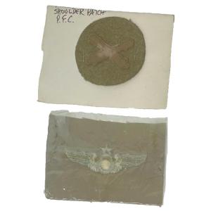 Photo of WWII Wing bomb cloth embroidered in Khaki and WWI US Military Army field artille