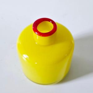 Photo of Yellow Glass Bottle With Red Accent Mid Century