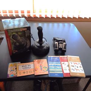 Photo of WINDOWS GAME CONTROL, BINOCULARS, PAMPHLETS AND GLASS POP BOTTLES