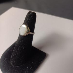 Photo of STERLING SILVER RING WITH WHITE STONE