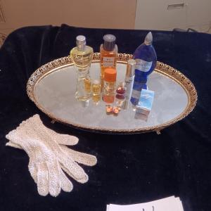 Photo of DRESSER MIRROR, VARIETY OF PERFUMES AND DRESS GLOVES
