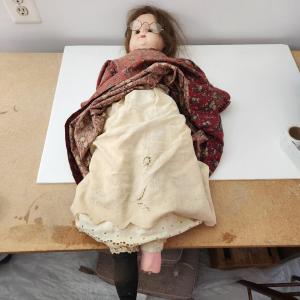 Photo of Vintage Large Doll w many layers of Clothing