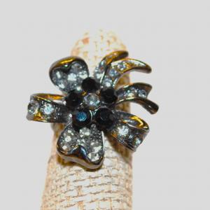 Photo of Size 7 Bowtie Split-Band Ring with Centered 5 Black Stones and Clear Stones Surr