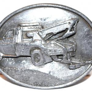 Photo of "Tow Truck Towing" Belt Buckle Sishiyou Co. ©1990 Oval 3" x 2 ½"