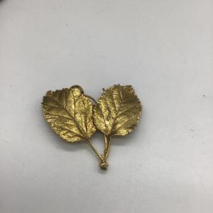 Photo of Gold toned leaf pin