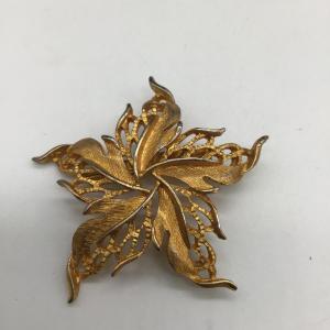 Photo of Gold toned leaf pin