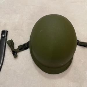 Photo of military helmet and sheath.