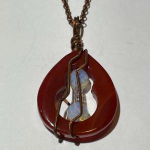 Photo of Vintage Carnelian Pendant on a 24" Copper Chain in VG Preowned Condition.