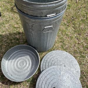 Photo of 2 metal trash cans and oil pan