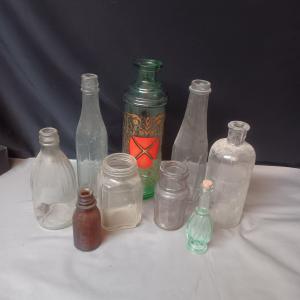 Photo of A COLLECTION OF VINTAGE AND ANTIQUE BOTTLES