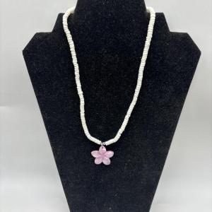Photo of White necklace with pink flower