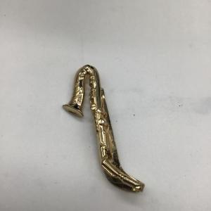 Photo of Swank vintage saxophone clip