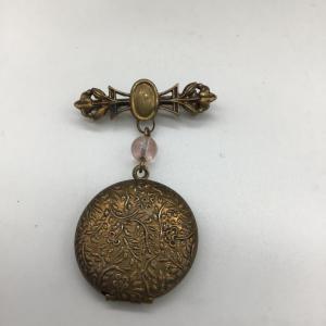 Photo of Vintage pin with locket