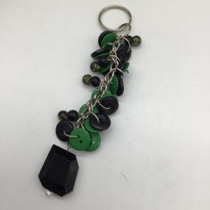 Photo of Black and green keychain charm