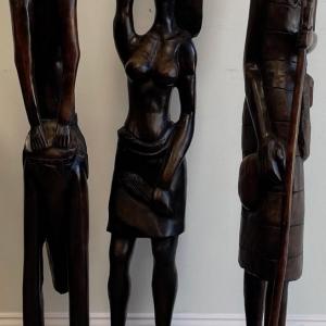 Photo of Three Tall Robust Wood African Statues