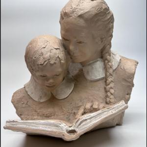 Photo of Two Girls Reading Sculpture