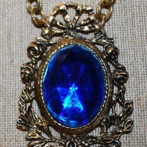 Photo of Large Vintage Theatrical Designed Oval Blue Faceted Stone PENDANT (3" X 2") on a