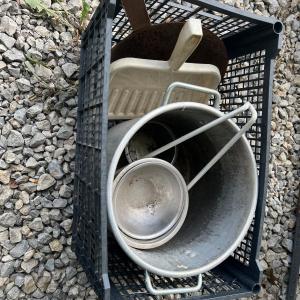 Photo of Plastic crate with metal bowls etc