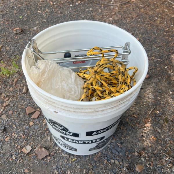 Photo of 5 gallon Ace bucket of misc tools and hardware