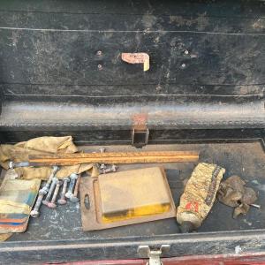 Photo of Red and black metal toolbox with contents