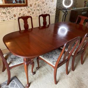 Photo of Queen Anne Cherry Dining Room Table with 6 chairs.