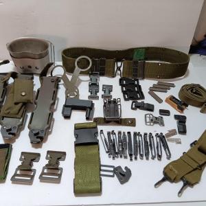 Photo of Large assortment of hooks and clips for military issued belts and tactical vests