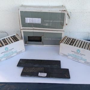 Photo of Boxes of black tile American Olean & Charcoal ledgestone