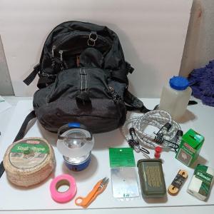 Photo of compass backpack with a variety of Bug out gear - decontamination kit - light - 