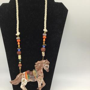 Photo of Hand painted and signed by Korian Designs moveable legs horse necklace