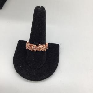 Photo of Rose gold colored flowers ring