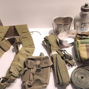 Photo of Large assortment of Military canvas bags and canteen with shoulder straps