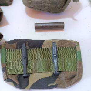 Photo of US Military canvass bags, a canteen, belt, camo face paint - face net and more