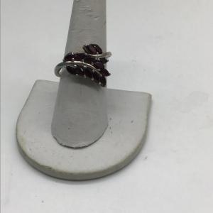Photo of 925 silver ring with ruby colored stones